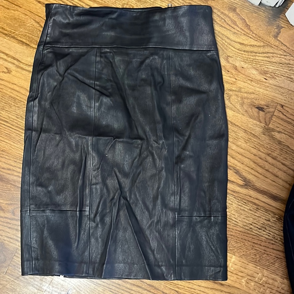Black knee length leather skirt